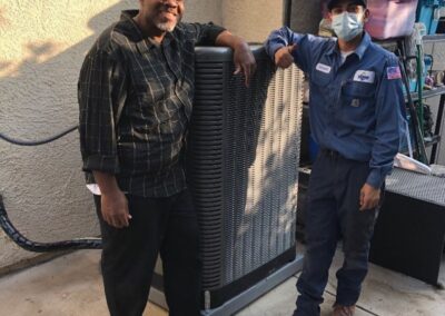 HVAC Technician Standing with Valued Customer